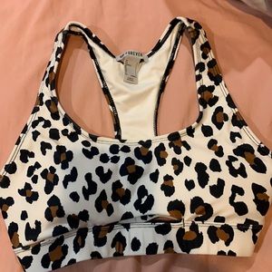 Brown, black, and white cheetah print sports bra